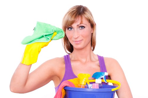 Professionals performing deep cleaning in a modern kitchen